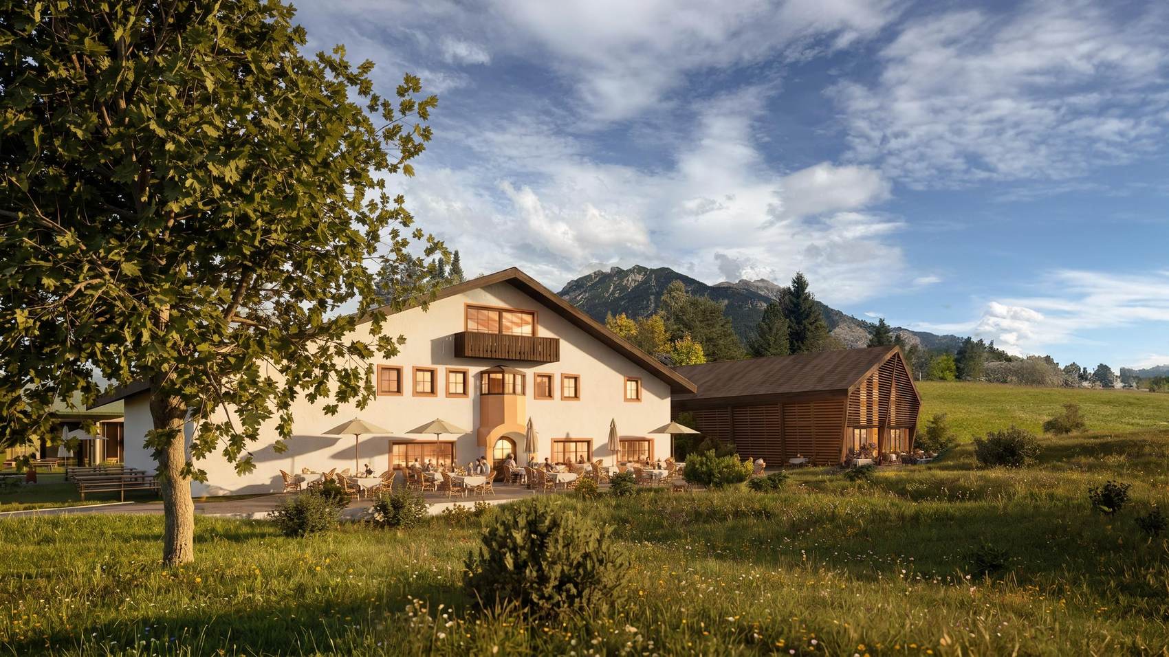 Der bestehende Tonihof von Süden mit Gastterrasse, daneben ein neuer Gebäudeteil in Holzlamellen.